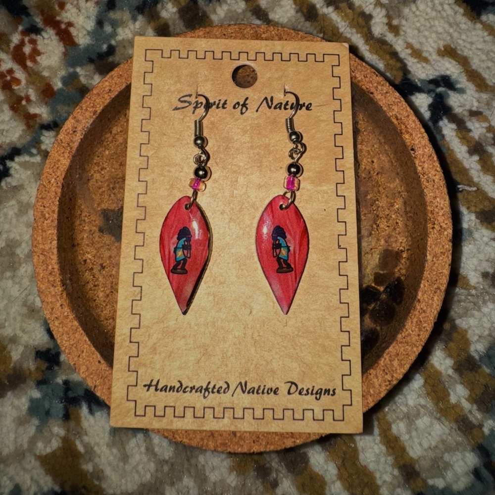 Kokopelli dangly red earrings.